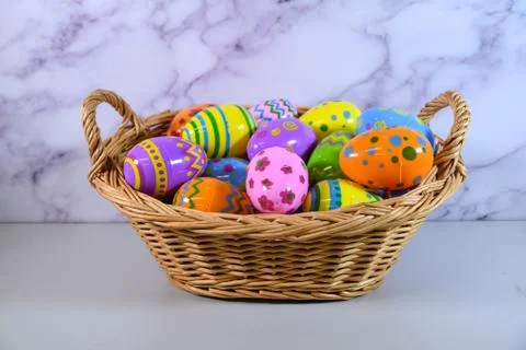 Easter Basket with colorful Easter Eggs Stock Photos