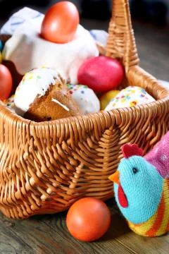 Easter basket with easter cakes and eggs. Stock Photos