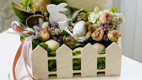 Easter basket with Easter eggs on a white background. 4K Stock Footage 124253386