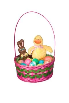 Easter basket with eggs and candy Stock Photos