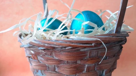 Easter basket with eggs and straw Stock Footage 106253987