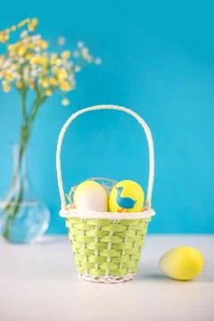 Easter basket with eggs on white background. Stock Photos