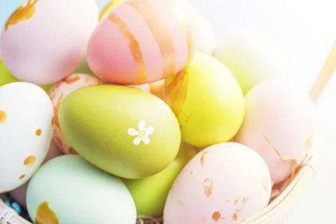 Easter basket filled with painted Easter eggs. Colorful painted Easter eggs i Stock Photos