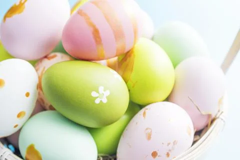 Easter basket filled with painted Easter eggs. Colorful painted Easter eggs i Stock Photos
