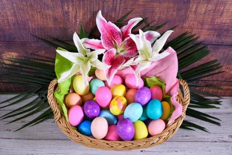 Easter Basket With flowers and Easter eggs Stock Photos