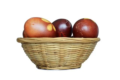 Easter basket full of cracked Easter eggs isolated on white background Stock Photos