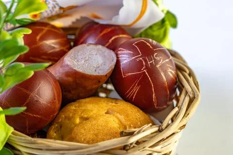 Easter basket, with sausages, bread, eggs, Easter eggs, cold cuts to be ble.. Stock Photos
