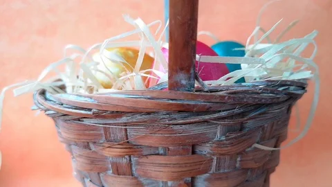 Easter basket with straw and eggs Stock Footage 106253994