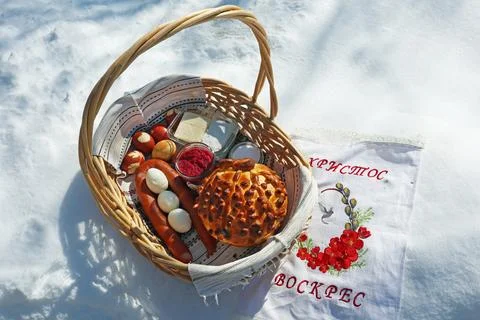 Easter basket with various snacks Stock Photos