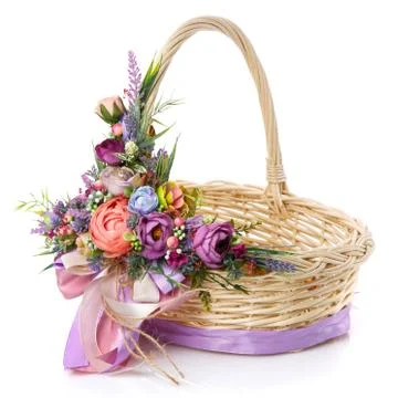 Easter basket on white background. Decorated with a large decoration of brigh Stock Photos