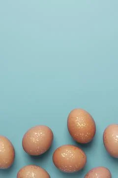 Easter beige eggs on a blue background. Flat lay, copy space. beautiful Stock Photos