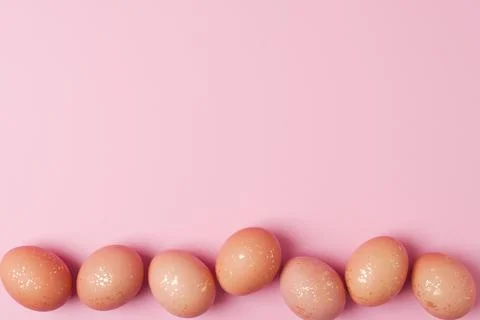 Easter beige eggs on a pink background. Flat lay, copy space. beautiful Stock Photos