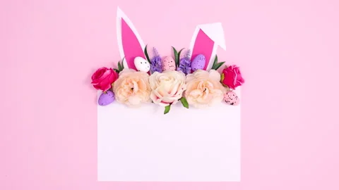 Easter bloom arrangement with bunny ears on paper card note.stop motion Stock Footage 149914564