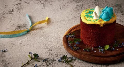 Easter board. Easter cake decorated with cream in the colors of the Ukrainian Stock Photos