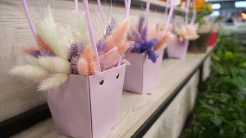 Easter bouquets on a store shelf. Beautiful bouquets in metal vases Stock-Footage 264160024