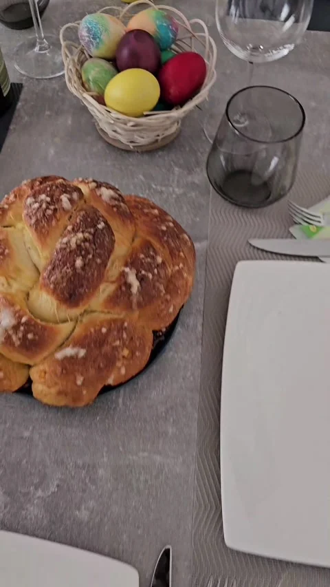 Easter Bread and Decorated Eggs: Festive Table Setting Stock Footage 240638638