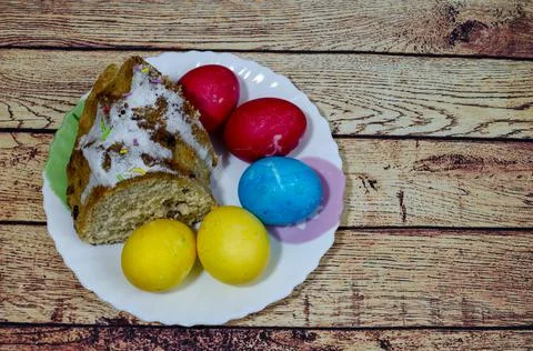 Easter bread and eggs on a plate Stock Photos