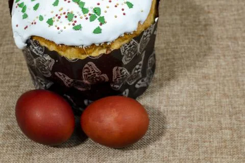 Easter bread and eggs on a rough cloth Stock Photos