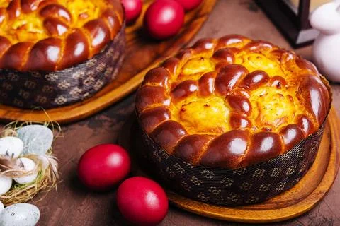 Easter bread and eggs on wood Stock Photos