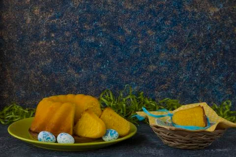 Easter bread on green plate and painted Easter eggs 写真素材