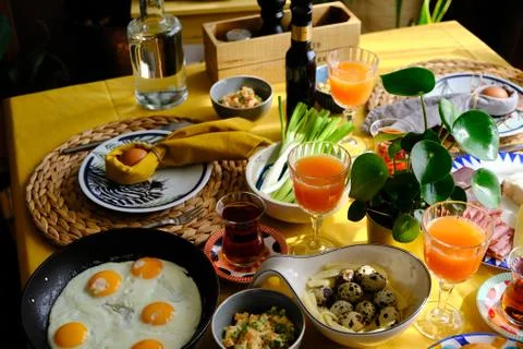Easter breakfast. Cosy home environment. Warm breakfast table. Stock Photos