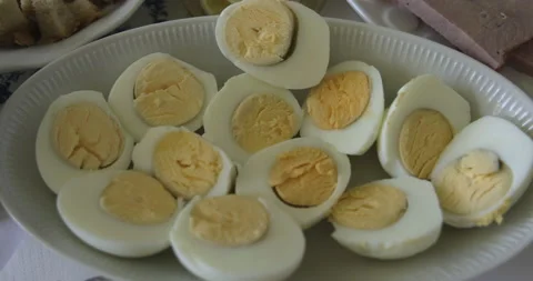 Easter breakfast, egg halves on a plate, 4K slomo Stock Footage 184016831