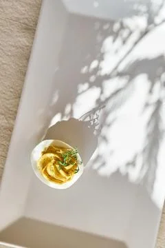 Easter breakfast idea. Stuffed easter eggs mimosa with egg yolk, turmeric, .. Stock Photos