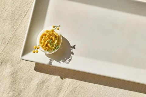 Easter breakfast idea. Stuffed easter eggs mimosa with egg yolk, turmeric, .. Stock Photos