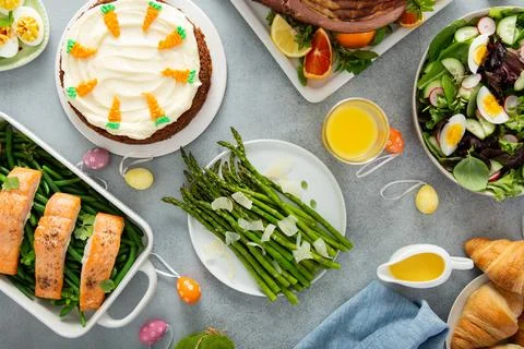 Easter brunch with spiral cut ham and roasted salmon Stock Photos
