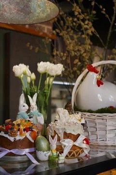 Easter Brunch Table with Decorated Cakes and Bunnies Fotos de archivo