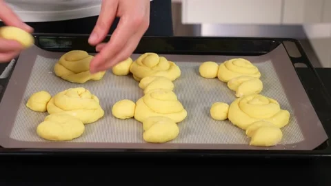 Easter bunnies from dough on a baking sheet Stock Footage 169571919