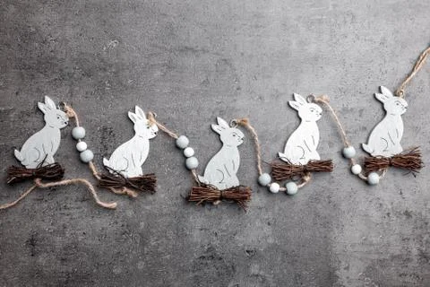 Easter bunnies on a grey rustic background Stock Photos