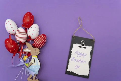 Easter bunny and Easter eggs on purple background Stock Photos