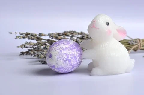 Easter bunny and egg on a light purple background. Dried flowers. Easter. Stock Photos