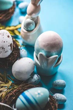 Easter bunny and Painted Easter eggs in bird's nests Stock Photos