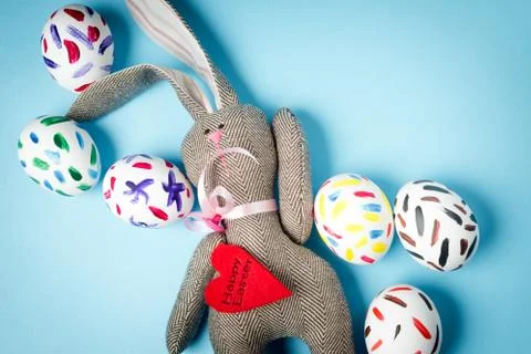 Easter bunny on a blue background Stock Photos
