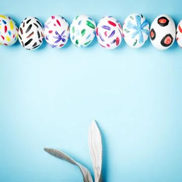 Easter bunny on a blue background Stock Photos