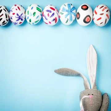 Easter bunny on a blue background Stock Photos