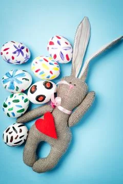 Easter bunny on a blue background Stock Photos
