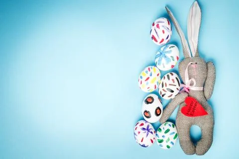 Easter bunny on a blue background Stock Photos