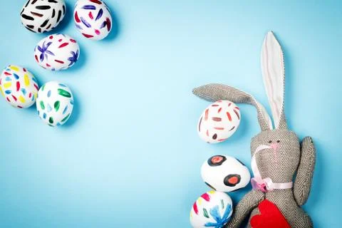 Easter bunny on a blue background Stock Photos