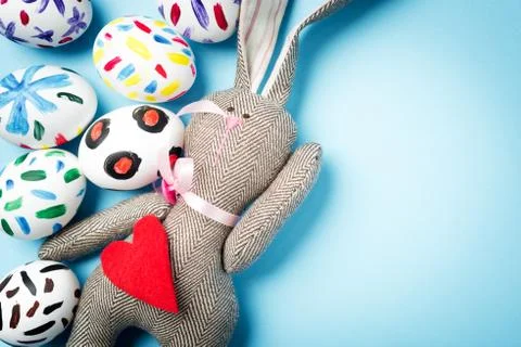 Easter bunny on a blue background Stock Photos