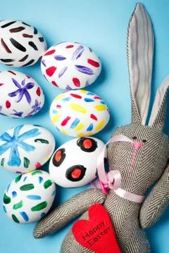 Easter bunny on a blue background Stock Photos