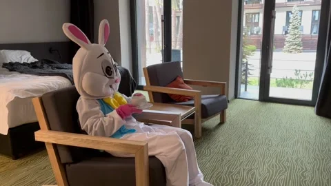 Easter Bunny Drinks from Cup Stock Footage 305383024