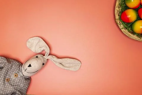 Easter bunny with easter basket and multiple colored easter eggs Stock Photos