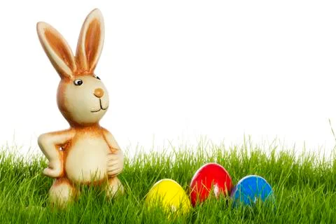 Easter bunny with easter eggs in grass Stock Photos