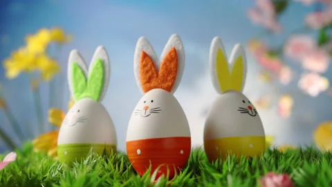 Easter Bunny with Easter Eggs, Spring Flowers, Green Grass Stock Footage 168475871