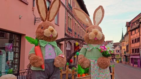 Easter bunny figures decorating historic town street in Colmar pan, 4K Stock Footage 340846918