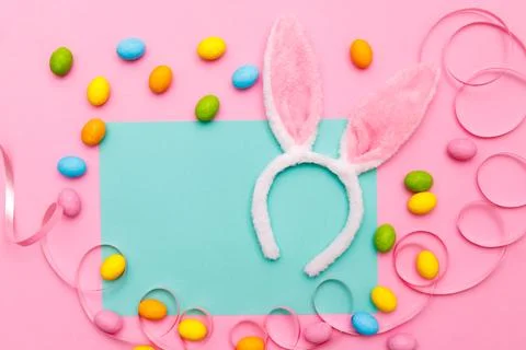 Easter bunny. Happy Easter holiday background concept.Flat lay colorful bun.. Stock Photos