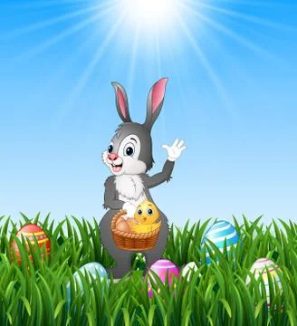Easter bunny holding a basket with easter egg and chick Stock Illustration